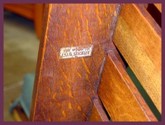 Signed under the arm with the decal used from 1912 to 1918 which reads: "The Work of L.&J.G. Stickley". 